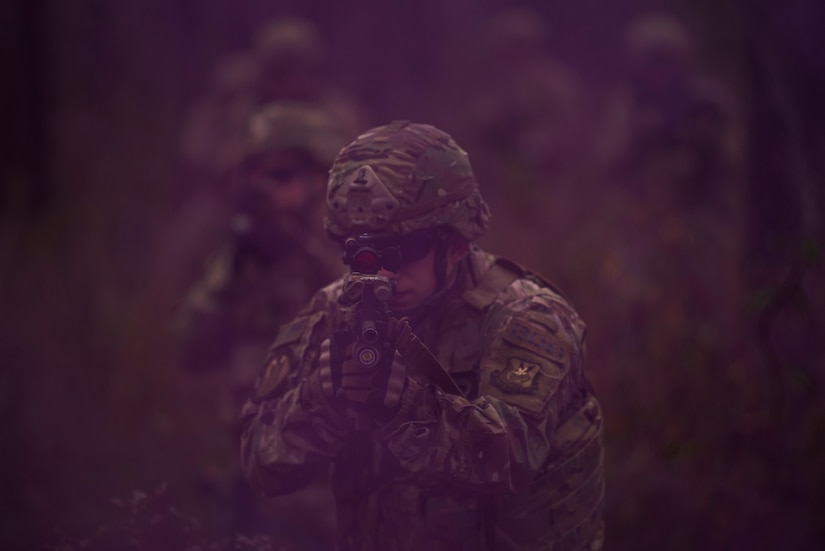 Members of the 823rd Base Defense Squadron move through smoke as concealment from simulated enemy forces, Moody Air Force Base, Jan. 12, 2018. The 823rd is one of three operational security forces squadrons under the 820th Base Defense Group whose mission is to provide high-risk force protection and integrated base defense for expeditionary forces. (U.S. Air Force photo by Bennie J. Davis III)