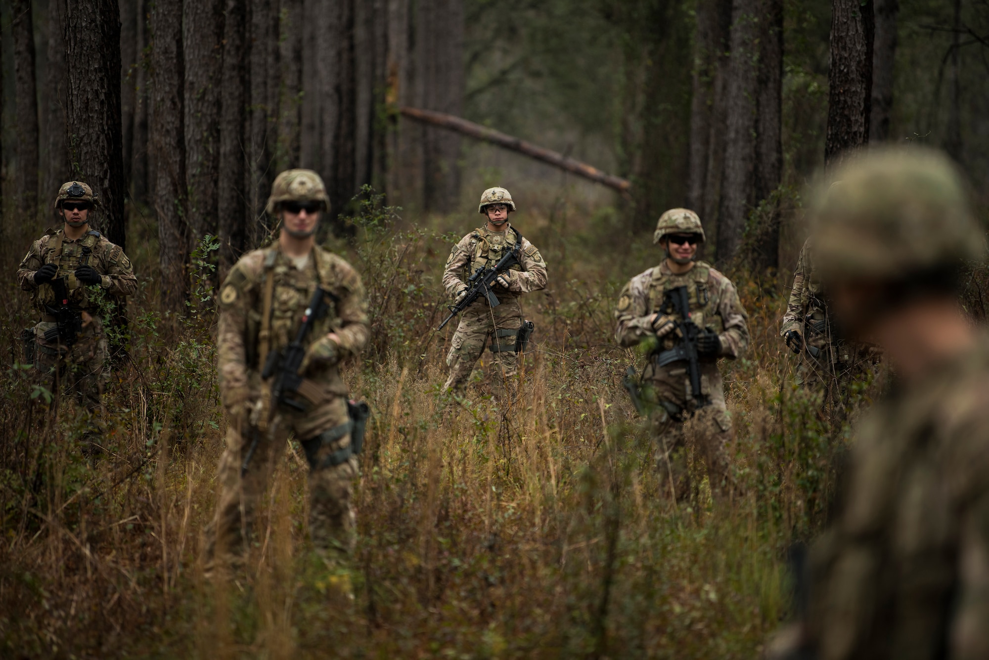 Members of the 823rd Base Defense Squadron for enemy forces during a training scenario, Moody Air Force Base, Jan. 12, 2018. The 823rd is one of three operational security forces squadrons under the 820th Base Defense Group whose mission is to provide high-risk force protection and integrated base defense for expeditionary forces. (U.S. Air Force photo by Bennie J. Davis III)
