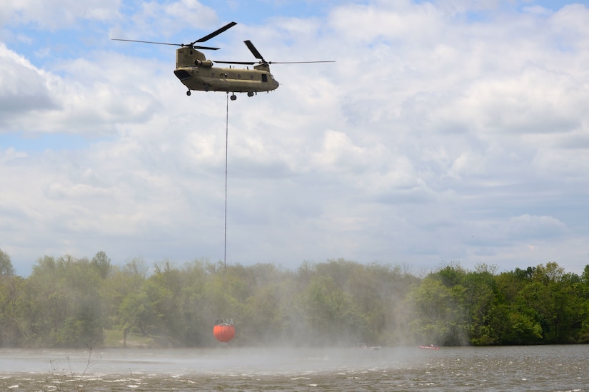 One CH-47 Chinook and two UH-60 Black Hawk helicopters conduct water bucket training May 11 at Memorial Lake State Park and Fort Indiantown Gap in coordination with safety and conservation ground personnel.