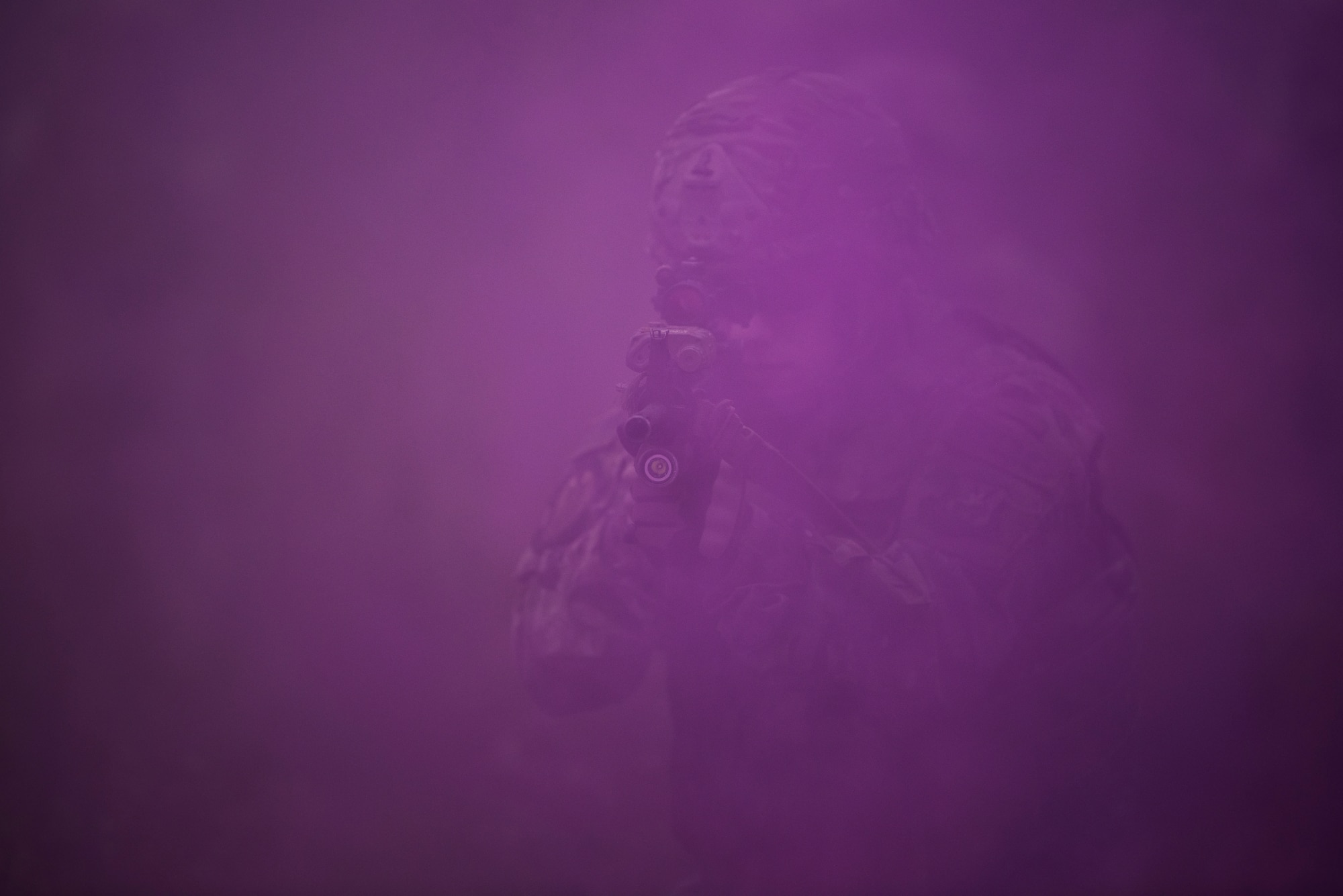 A member of the 823rd Base Defense Squadron moves through smoke as concealment from simulated enemy forces, Moody Air Force Base, Jan. 12, 2018. The 823rd is one of three operational security forces squadrons under the 820th Base Defense Group whose mission is to provide high-risk force protection and integrated base defense for expeditionary forces. (U.S. Air Force photo by Bennie J. Davis III)