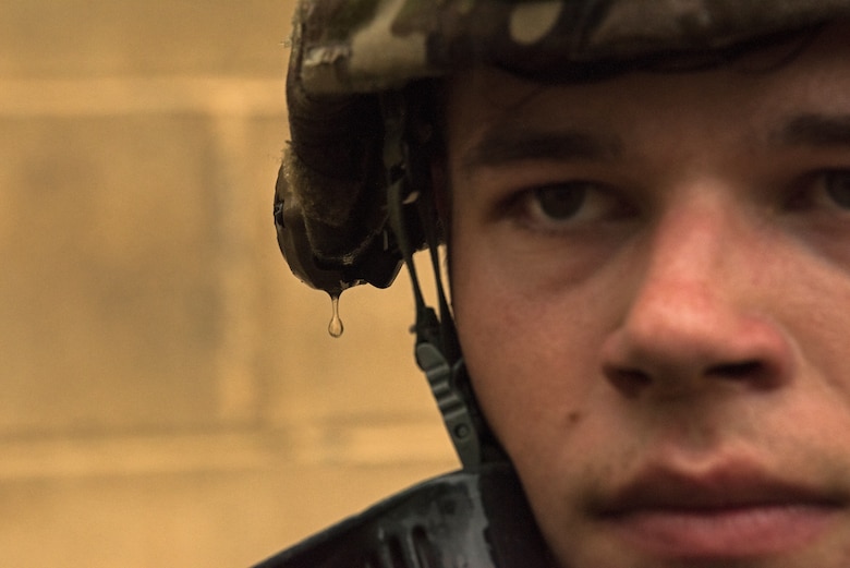 Airman 1st Class Mason Wiedrich, 823rd Base Defense Squadron fire team member, prepares for close quarters battle training scenario after a rain storm, Moody Air Force Base, Jan. 12, 2018. The 823rd is one of three operational security forces squadrons under the 820th Base Defense Group whose mission is to provide high-risk force protection and integrated base defense for expeditionary forces. (U.S. Air Force photo by Bennie J. Davis III)
