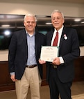Photo of Deputy Commander Frank Zardecki receiving and award from the Under Secretary of the Army Christopher Lowman