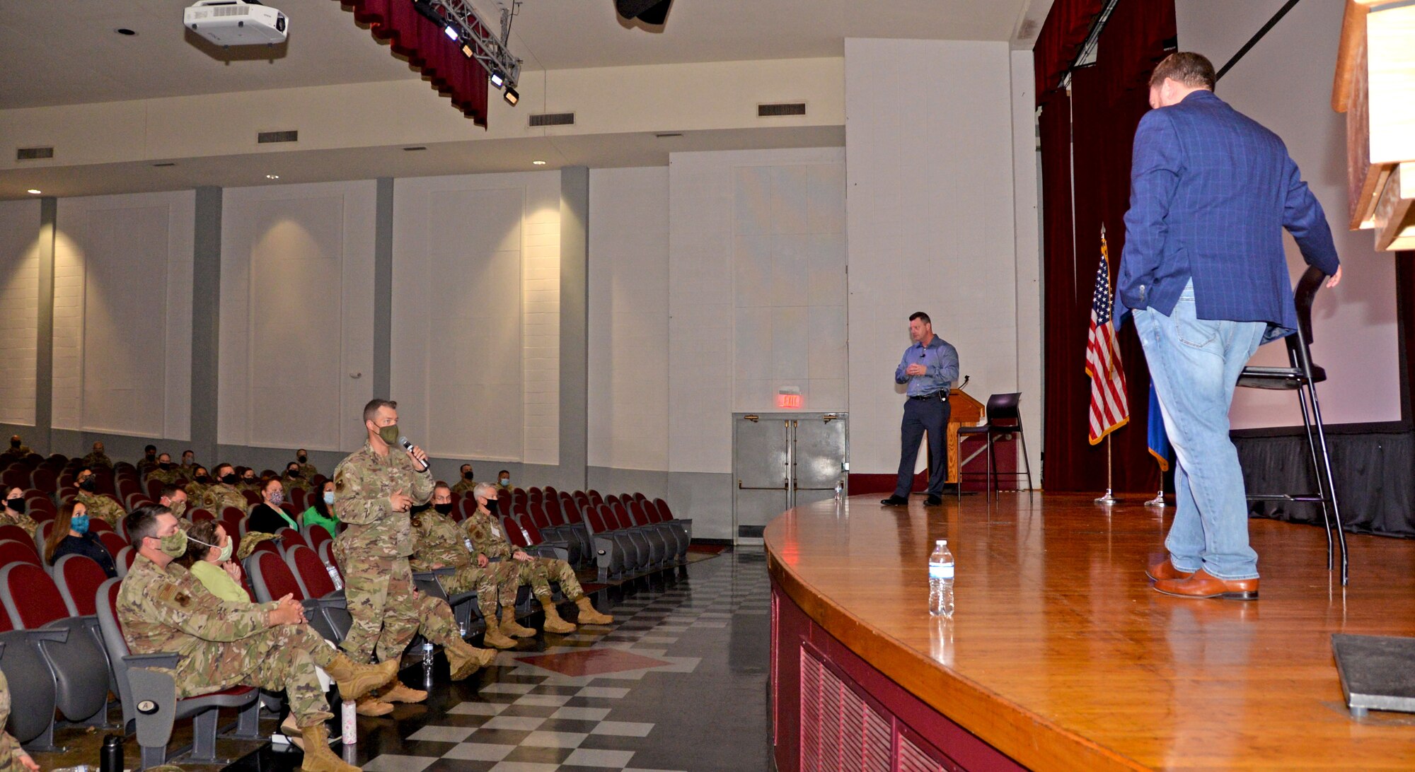 Col. Mark Estlund, 960th Cyberspace Operations Group commander, asks a question to Ernie Stevens and Joe Smarro, San Antonio Police Department Mental Health Unit officers, during the 960th Cyberspace Wing Mental Health and Resiliency Fair, May 1, 2021, at Joint Base San Antonio-Lackland, Texas. (U.S. Air Force photo by Tech. Sgt. Samantha Mathison)