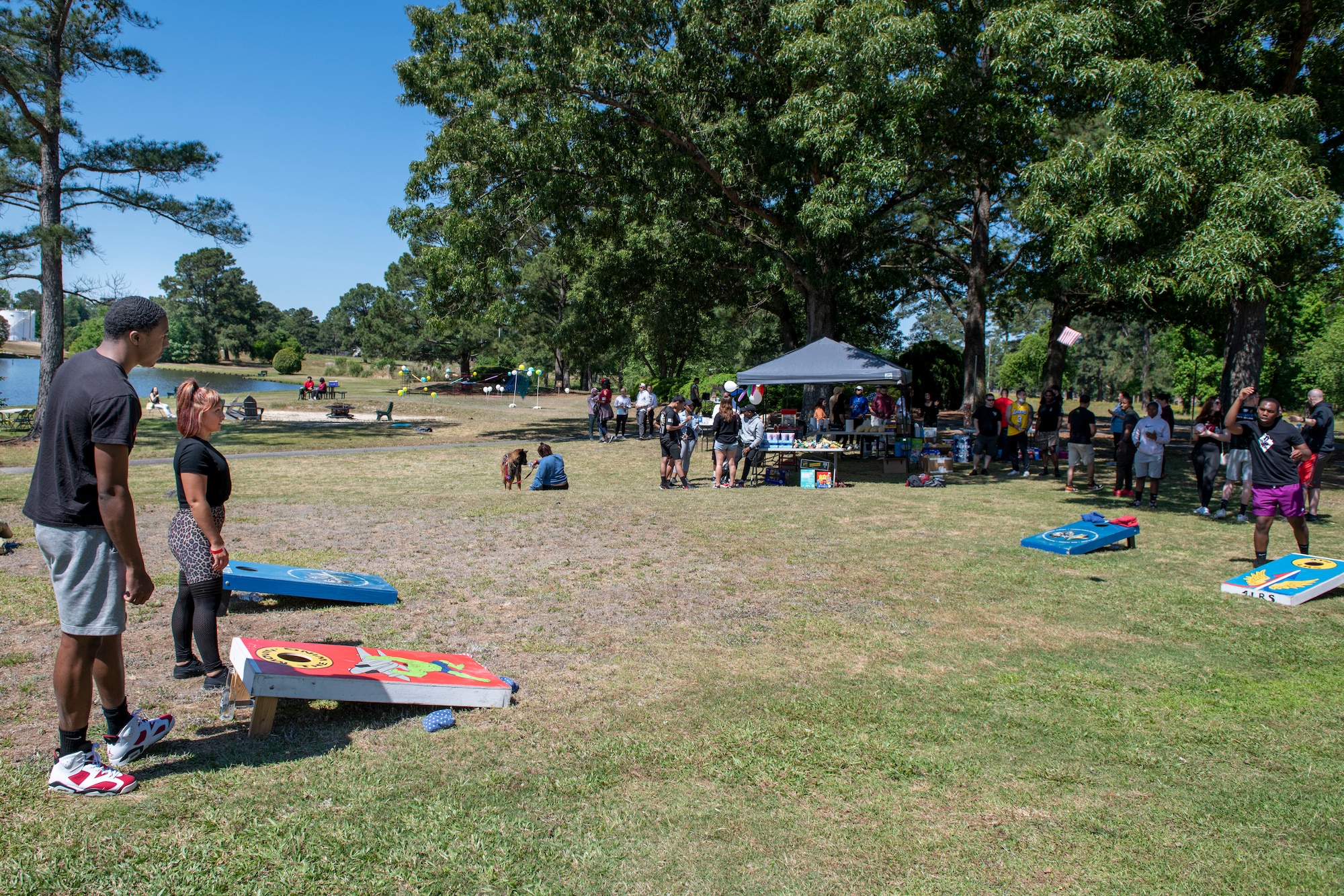 Members of Team Seymour gather to play cornhole at Outdoor Recreation on Seymour Johnson Air Force Base, North Carolina, May 14, 2021.