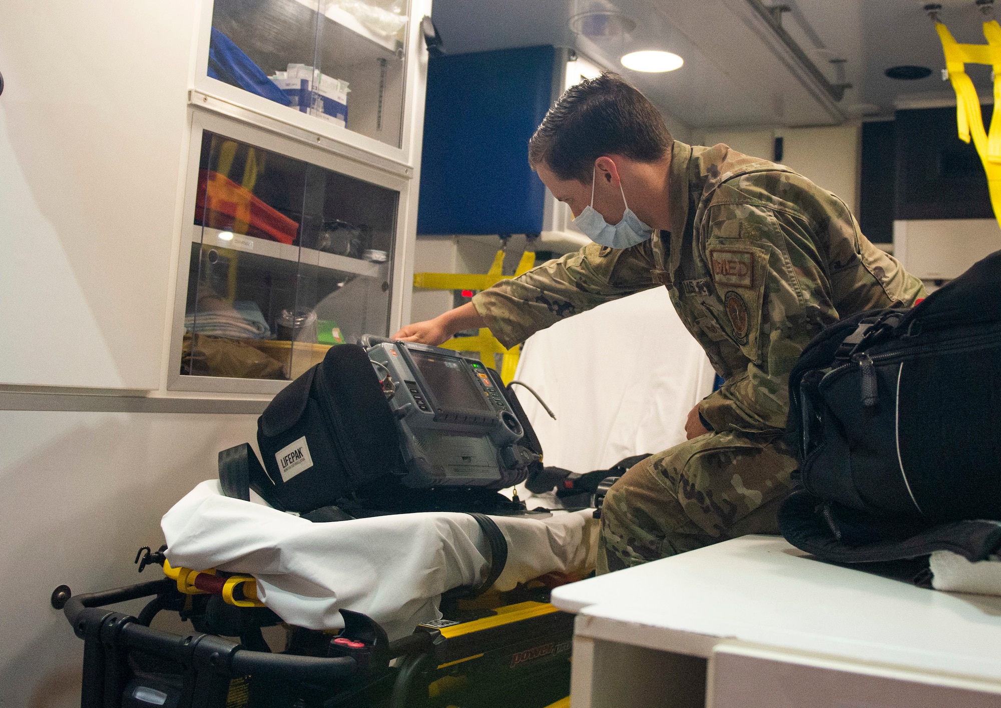 U.S. Air Force Staff Sgt. David Henderson, a paramedic with the 88th Medical Group, performs an inspection of equipment inside the ambulance outside the Wright-Patterson Air Force Base, Ohio Medical Center, April, 28, 2021. The medical center is open 24 hours a day with medical personnel standing by to treat anyone that comes through their door. (U.S. Air Force photo by Wesley Farnsworth)