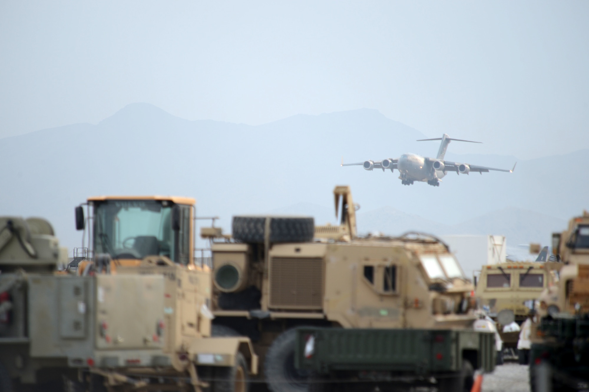 A C-17 Globemaster III aircraft deployed from McChord Airfield, Wash., descends for landing at Bagram Air Field, Afghanistan, Nov. 2, 2014. The men and women of Bagram Air Field service the Department of Defense’s busiest single runway. Airmen and civilian contractors work 24 hours a day, seven days a week to ensure airfield operations are successfully accomplished. (U.S. Air Force photo by Master Sgt. Cohen A. Young/Released)