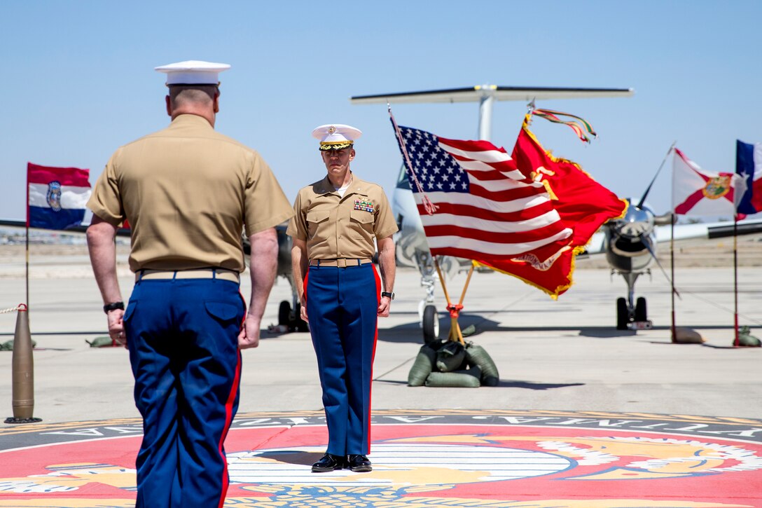 U.S. Marine Corps Lt. Col. Olgierd J. Weiss III stands at attention during a retirement ceremony at Marine Corps Air Station Yuma, Ariz. May 21, 2021.