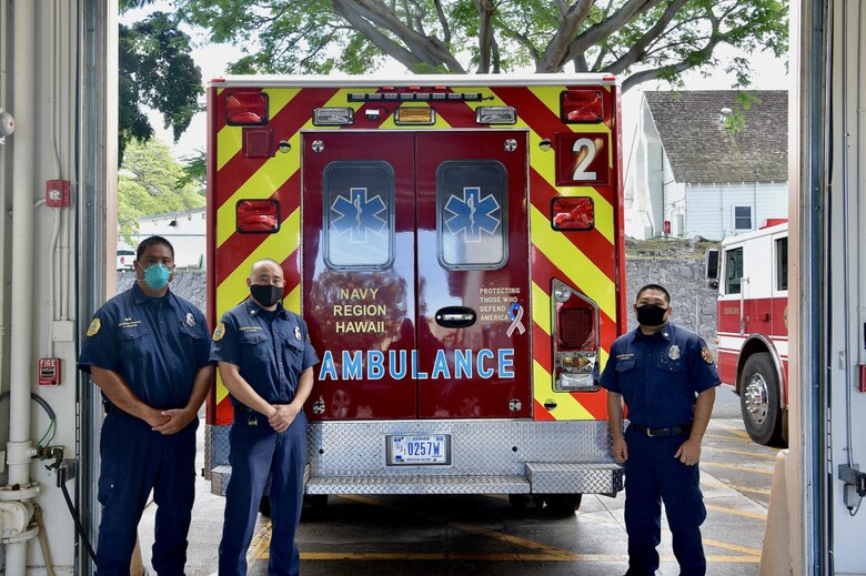 Dean Mizukami, Gabe Sasaki, and Jared Nakamura, Navy Federal Fire Department first responders, finish their night shift at Joint Base Pearl Harbor-Hickam, Hawaii, May 19, 2021. The Navy Federal Fire Department is a JBPHH unit that encompasses sailors, airmen, and civilians. (U.S. Air Force photo by 2nd Lt. Benjamin Aronson)