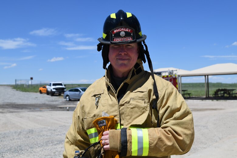 Lt. Col. Michael Hall, Buckley Garrison Inspector General, prepares for a fire exercise, May 25, 2021, on Buckley Air Force Base, Colo. The Buckley Fire Department showed Buckley Garrison leadership what their duties may entail with a simulated two-story fire exercise. (U.S. Space Force photo by Senior Airman Michael D. Mathews)