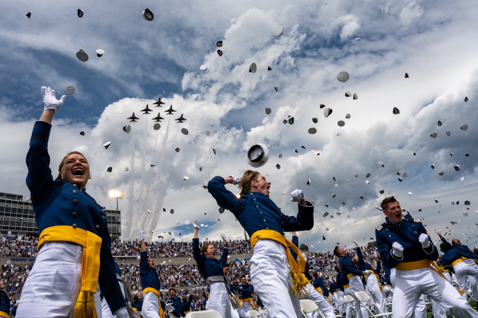 The U.S. Air Force Air Demonstration Squadron "Thunderbirds" perform a fly-over at the Air Force Academy graduation at Falcon Stadium in Colorado Springs, Colo., May 26, 2021. In all, 1,019 cadets graduated in front of a select crowd due to safety and health precautions set in place for the ceremony as the Academy continues to operate during the pandemic. (U.S. Air Force photo by Staff. Sgt Laurel M. Richards)