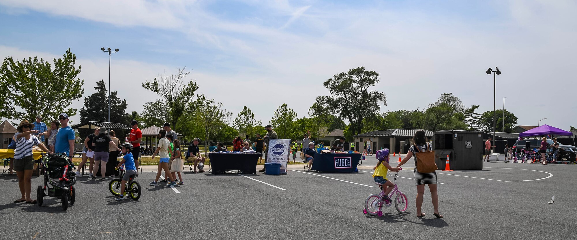 Airmen and their families ride bikes and enjoy activities during the Bicycle Rodeo at Dover Air Force Base, Delaware, May 22, 2021. The first-of-its-kind event was created to strengthen community ties while educating base youth on safe cycling habits in a fun and interactive way. (U.S. Air Force photo by Airman 1st Class Stephani Barge)