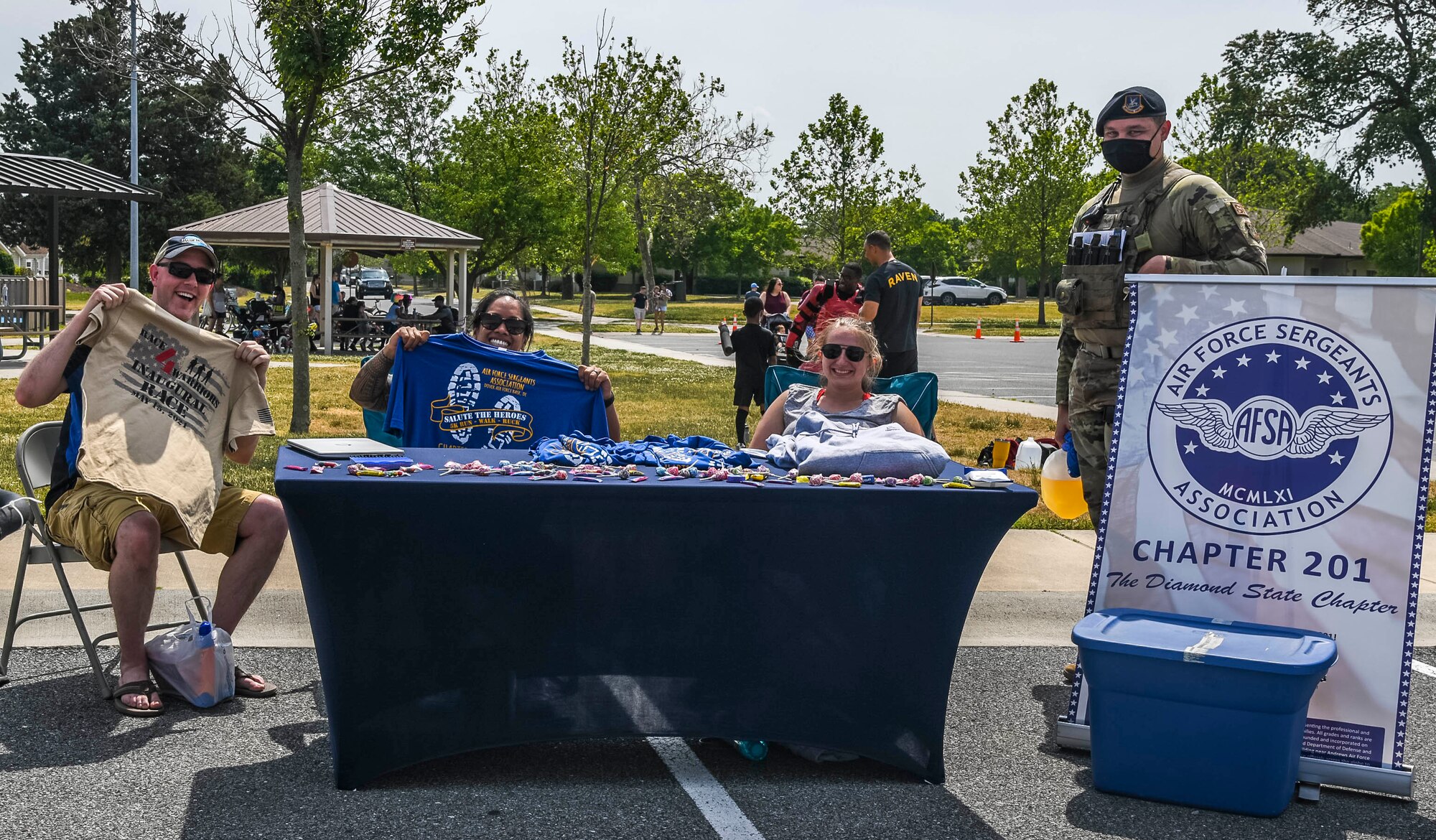 Members of the Dover Air Force Base Air Force Sergeants Association pose for a photo during the Bicycle Rodeo at Dover AFB, Delaware, May 22, 2021. A variety of agencies from Dover AFB had booths at the event sharing available resources, activities and services for military members and their families. (U.S. Air Force photo by Airman 1st Class Stephani Barge)