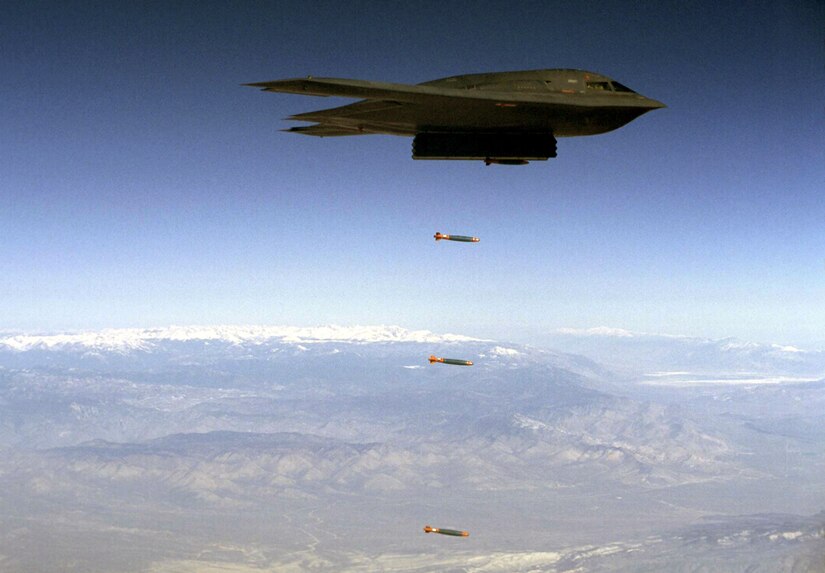 A B-2 Spirit drops Joint Direct Attack Munitions separation test vehicles over Edwards Air Force Base, Calif., Aug. 8, 2003.(Courtesy photo)