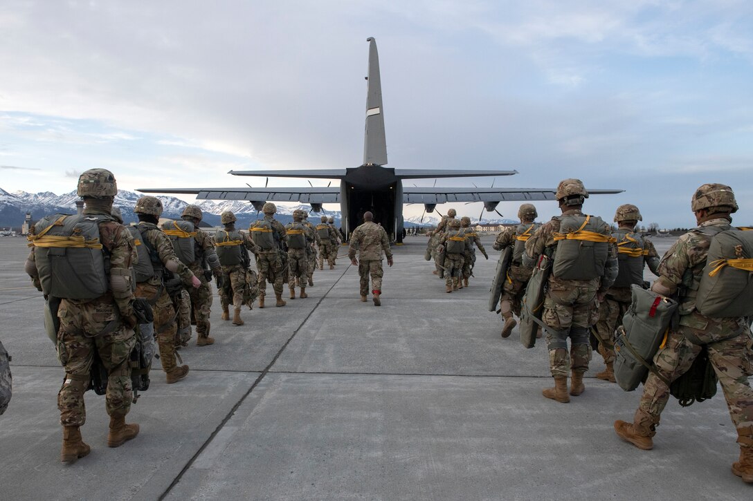 Soldiers board a C-130J