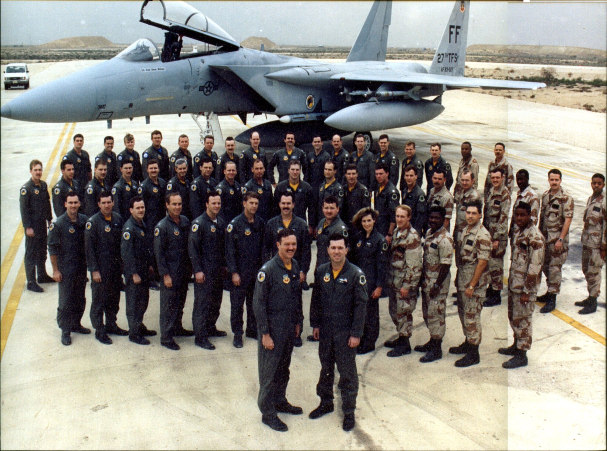 Then Lt. Col. Mark E. Smith, second row, fourth from left, poses with the rest of the 27th Tactical Fighter Squadron at Dhahran Air Base, Saudi Arabia during Operation Desert Shield/Desert Storm in 1991. Courtesy photo // Maj. Gen. Mark Smith