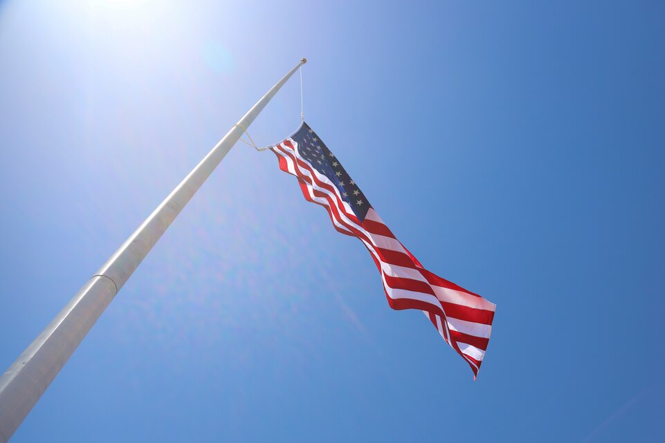 The American flag flies high over Marine Corps Air Station (MCAS) Yuma, May 14, 2021. This was the first time a flag rose on the new flagpole at MCAS Yuma. (U.S. Marine Corps photo by Lance Cpl. Matthew Romonoyske-Bean)