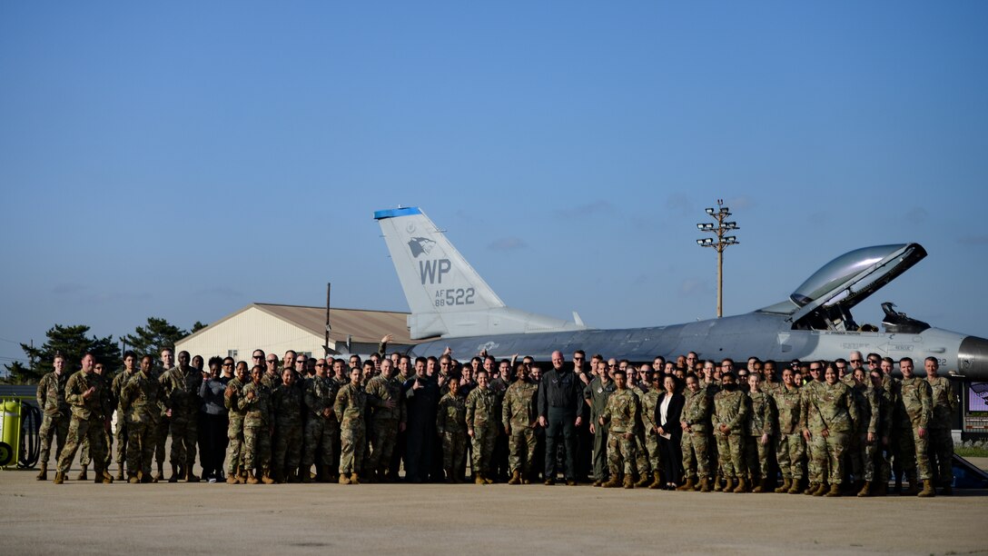 Airmen pose for a photo.