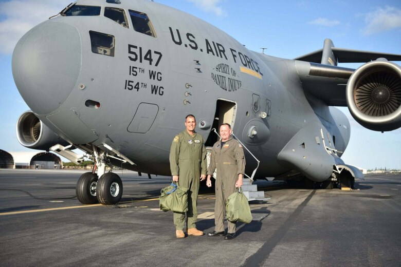 U.S. Navy Capt. Erik Spitzer, Joint Base Pearl Harbor-Hickam commander, and U.S. Air Force Col. Dan Dobbels,15th Wing commander, flew a C-17 together to demonstrate the U.S. Navy and U.S. Air Force partnership in securing stability in the Indo-Pacific region at Joint Base Pearl Harbor-Hickam, Hawaii, May 4, 2021. On Oct. 1, 2010, Naval Station Pearl Harbor joined with Hickam Air Force Base to become Joint Base Pearl Harbor-Hickam, Hawaii, to support both Air Force and Navy missions in the Pacific.

(U.S. Air Force photo by Tech. Sgt. Anthony Nelson Jr. )