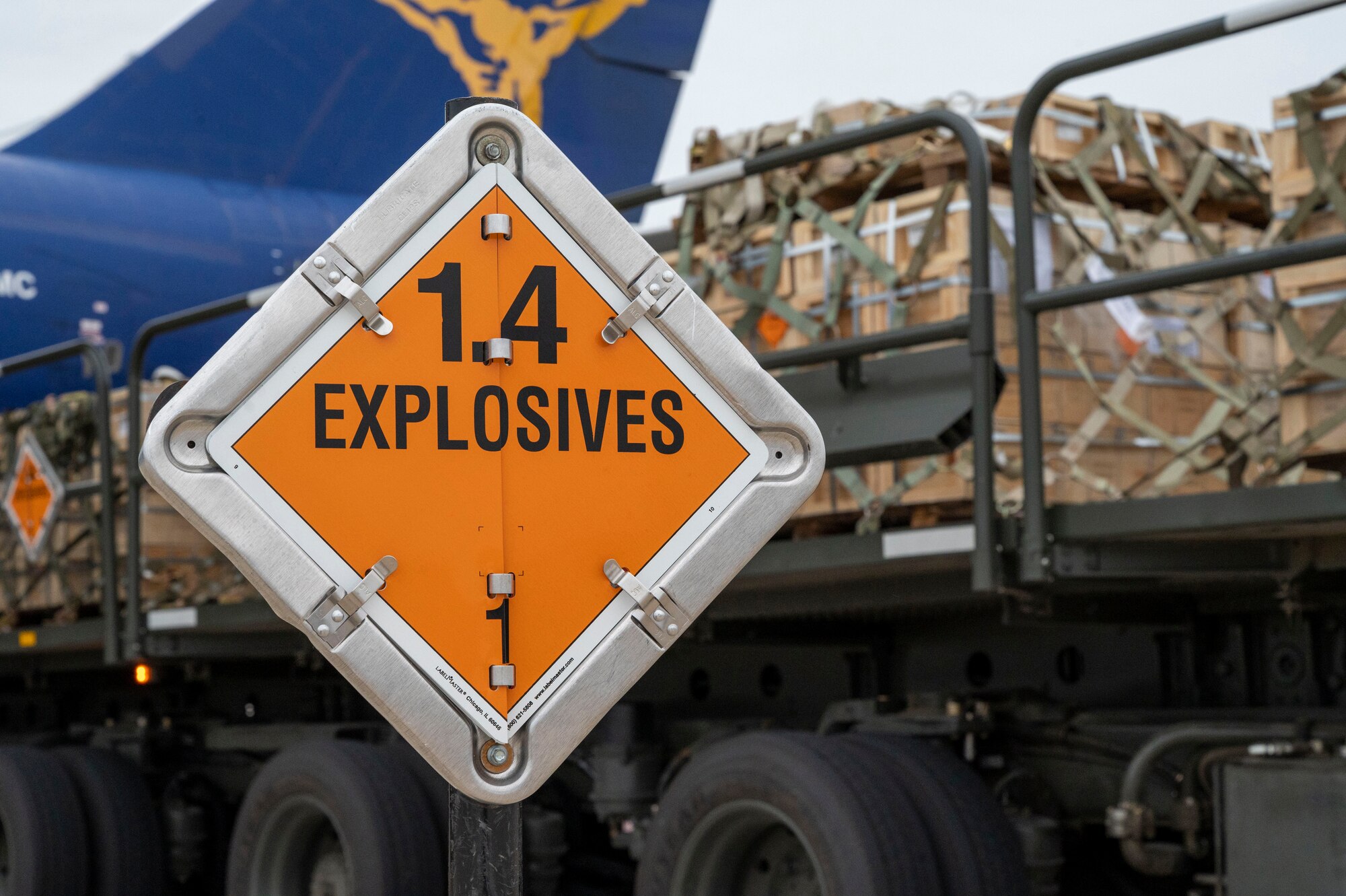 An explosives sign marks the cordon around an aircraft in support of a security assistance mission between the U.S. and Ukraine at Dover Air Force Base, Delaware, May 24, 2021. The U.S. and Ukraine first initiated a partnership in 1993. Missions such as this demonstrate the U.S.’s commitment to Ukraine’s independence, sovereignty and territorial integrity. (U.S. Air Force photo by Airman 1st Class Cydney Lee)