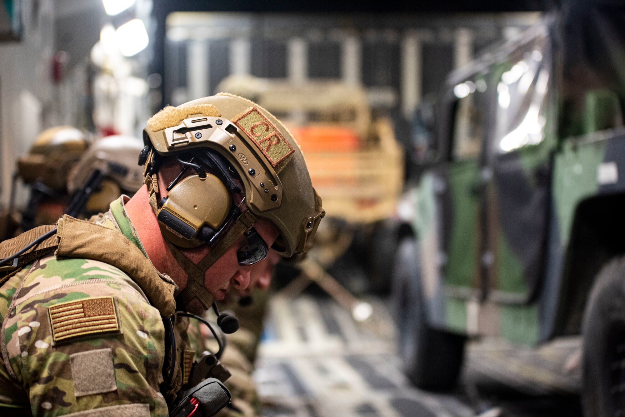 Tech. Sgt. Lance Oakes, 621st Contingency Response Squadron fire team lead, travels onboard a C-17 Globemaster to Volk Field Air National Guard Base, Wisconsin, May 25, 2021, during Exercise Mobility Guardian. Mobility Guardian includes Air Mobility Command’s first large-scale training on Agile Combat Employment and the employment of Multi-Capable Airmen. (U.S. Air Force photo by Airman 1st Class Matthew Porter)