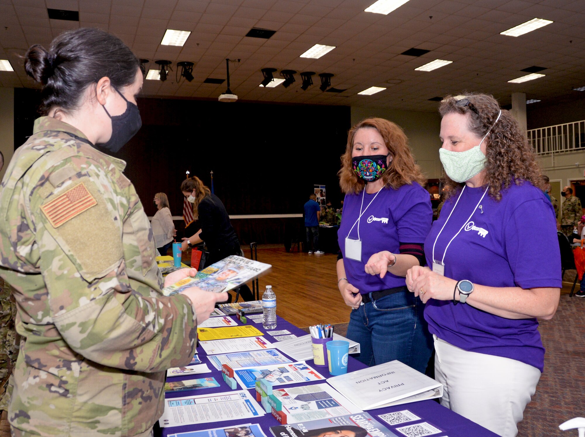 Maj. Kathleen Ball, 854th Combat Operations Squadron deputy division chief of the Intelligence, Surveillance and Reconnaissance Division, visits with 960th Cyberspace Wing key spouses, K.C. Erredge and Johanna Trelles, during the Mental Health and Resiliency Fair at Joint Base San Antonio-Lackland, Texas, May 1, 2021. (U.S. Air Force photo by Tech. Sgt. Samantha Mathison)