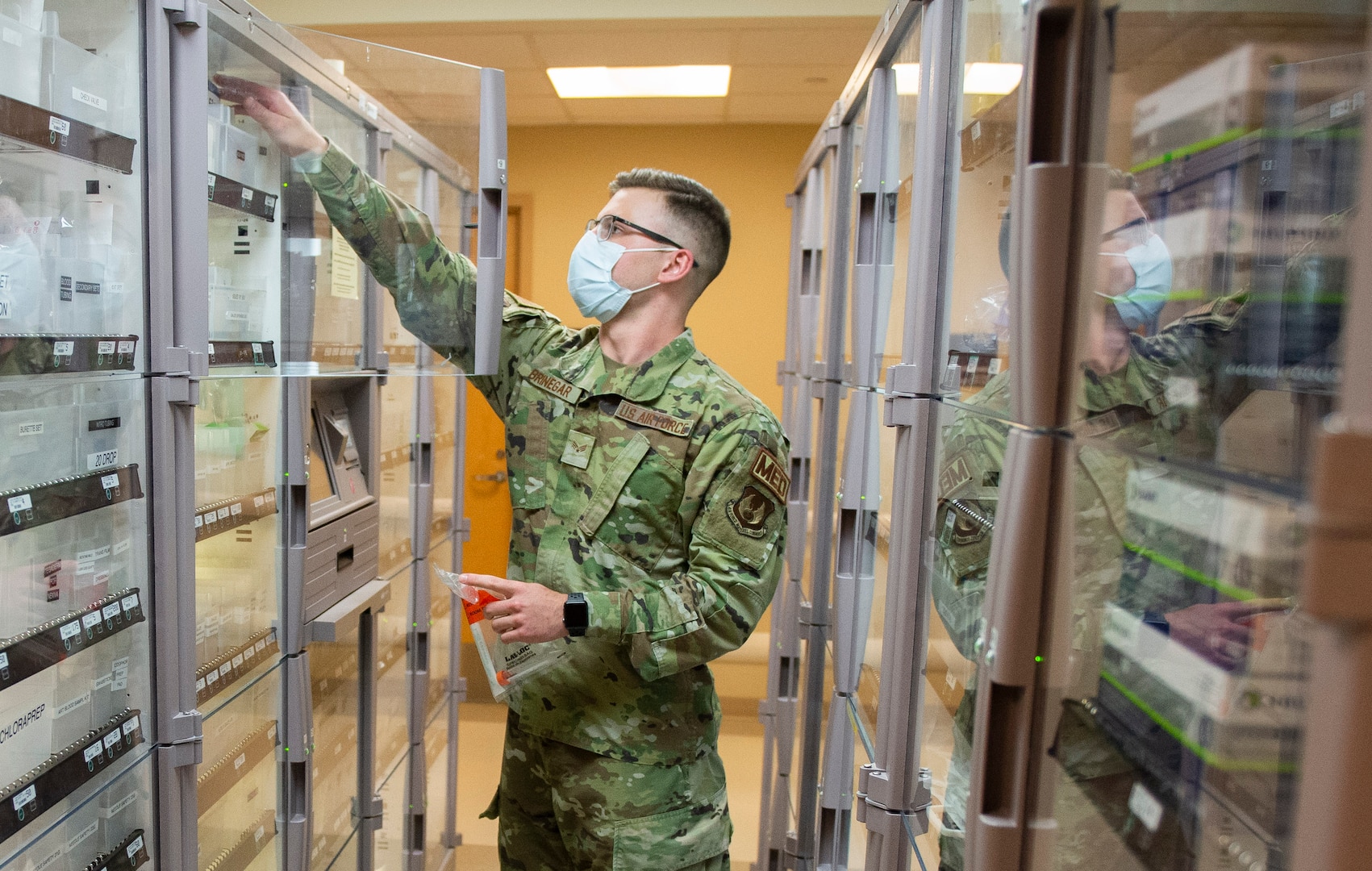 U.S. Air Force Senior Airman Joshua Bringer, a medical technician with the 88th Medical Group, retrieves supplies in the emergency room of the Wright-Patterson Air Force Base, Ohio Medical Center, April, 28, 2021. The medical center is open 24 hours a day with medical personnel standing by to treat anyone that comes through their door. (U.S. Air Force photo by Wesley Farnsworth)