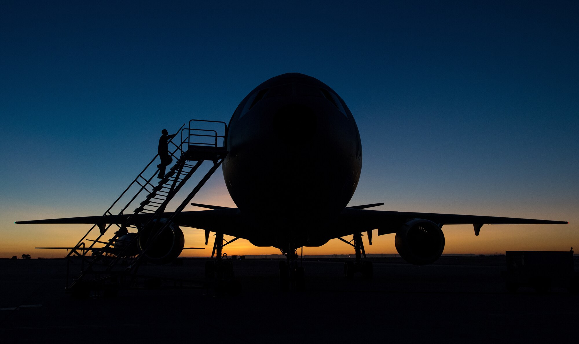 Airmen with the 6th Air Refueling Squadron prepare a KC-10 Extender before a mission to conduct a flyover for Maj. Brent Burklo’s funeral, July 16, 2019, at Travis Air Force Base, Calif. Burklo was a KC-10 pilot at the 6th ARS who died July 10, 2019, after a two-year battle with cancer. (U.S. Air Force photo by Master Sgt. Joey Swafford)