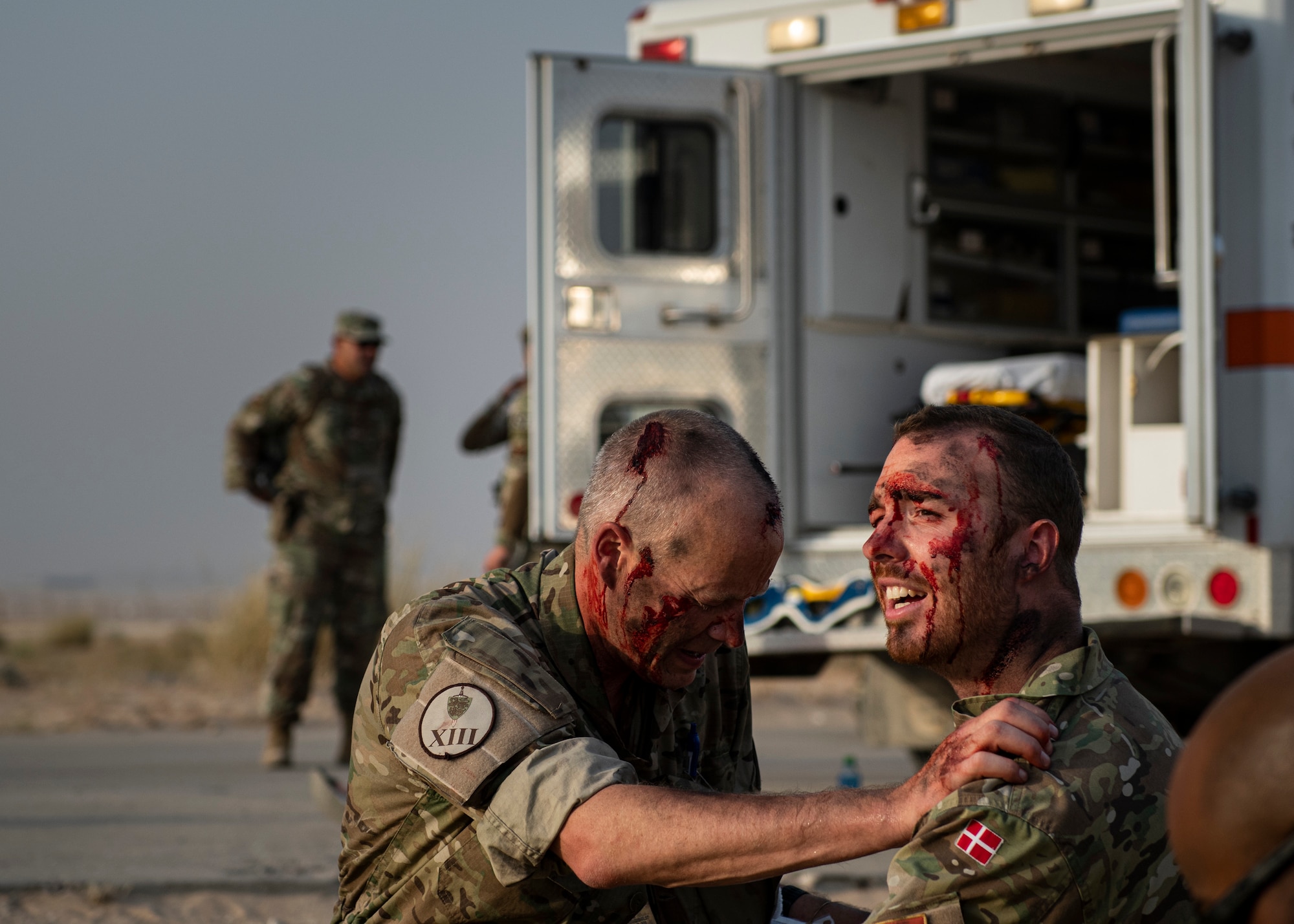 People acting as simulated casualties with injuries during a training exercise.