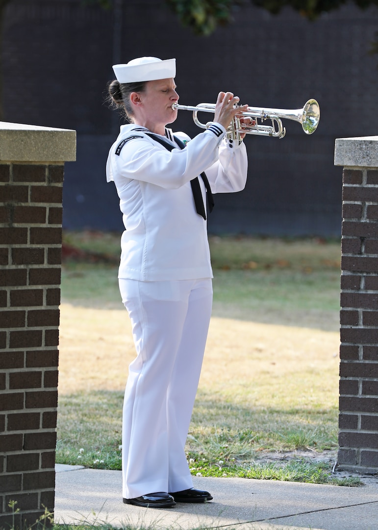 A bugler with the U.S. Fleet Forces Ceremonial Band performs Taps during the annual Norfolk Naval Shipyard Memorial Day Fall-In for Colors May 26.