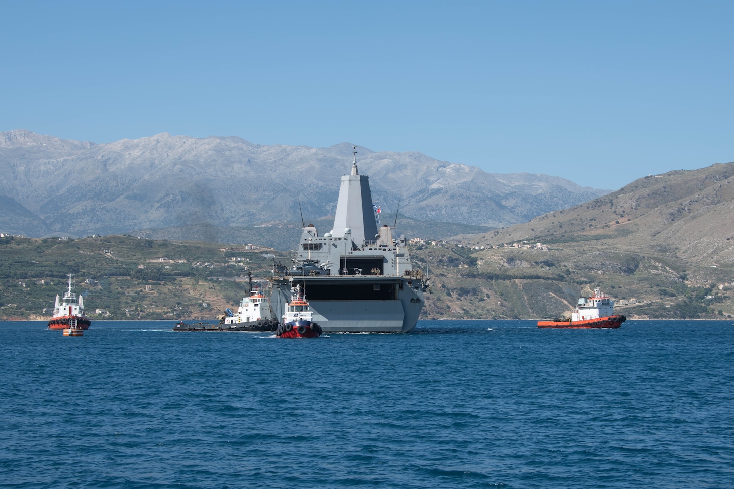 ) The amphibious transport dock ship USS San Antonio (LPD 17) arrives in Souda Bay, Greece, for a scheduled logistics and maintenance stop , May 27, 2021. San Antonio is operating in the U.S. Sixth Fleet area of operations with Amphibious Squadron 4 and the 24th Marine Expeditionary Unit (MEU) as part of the Iwo Jima Amphibious Readiness Group. NSA Souda Bay is an operational ashore base that enables U.S., allied, and partner nation forces to be where they are needed when they are needed to ensure security and stability in Europe, Africa, and Southwest Asia.
