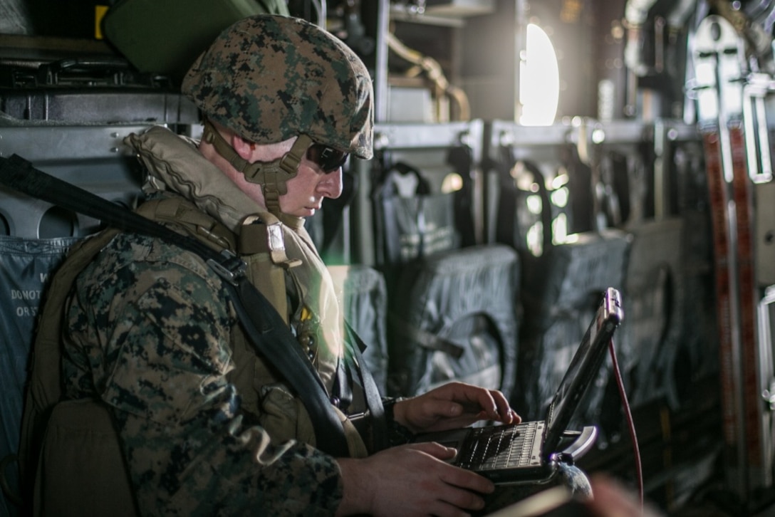 Lance Cpl. Nathan M. Sorenson, a data systems administrator with Command Element, 31st Marine Expeditionary Unit, and a native of Ubly, Michigan, tests the connectivity of the Networking On-the-Move Airborne communications system during flight operations from the amphibious assault ship, USS America (LHA 6), Sept. 22, 2020. The NOTM-A provides the mission commander the ability to command and control forces on the ground while flying above the battlefield. America, flagship of Expeditionary Strike Group 7, along with the 31st MEU, is operating in the 7th fleet area of operations to enhance interoperability with allies and partners and serve as a ready response force to defend peace and stability in the Indo-Pacific region.