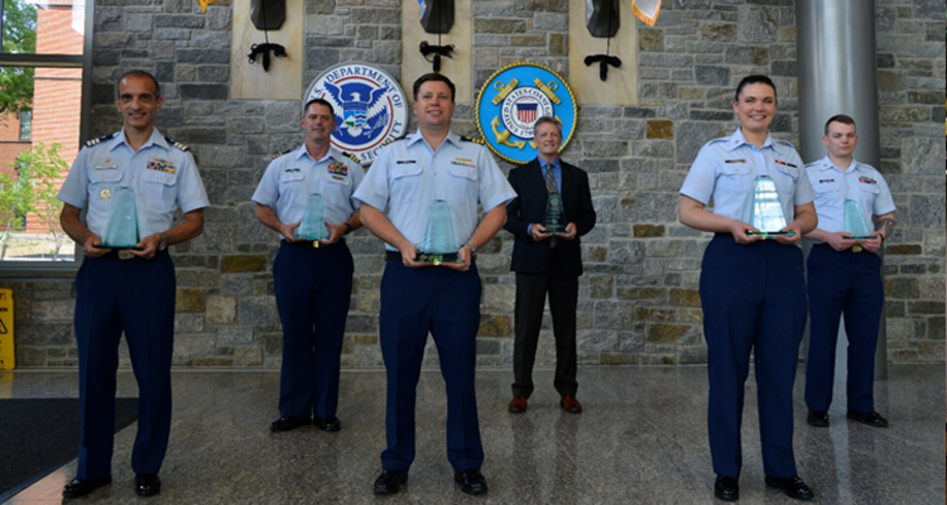 Representing the winners in each category of the 2020 Capt. Niels P. Thomsen Innovation Awards are, from left, Auxiliarist Alvaro Ferrando, Cmdr. Joel Carse, Cmdr. Baxter Smoak, Douglas Campbell, Petty Officer 3rd Class Kristin Talbott and Petty Officer 1st Class James Lenkiewicz.