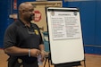 Special Agent Ricky Jenkins, Army Criminal Investigation Division, prepares for a briefing on the requirements of becoming a special agent, during a Career Fair held May 20, 2021, at Camp Arifjan, Kuwait. The event allowed subject matter experts to inform Soldiers about career opportunities while in Kuwait. (U.S. Army photo by Joseph Black)