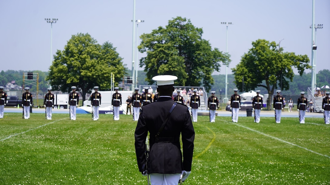 Marines with the U.S. Marine Corps Silent Drill Platoon perform during a Battle Color Ceremony as part of the U.S. Naval Academy Commissioning Week at the United States Naval Academy, Annapolis, Maryland, May 26, 2021. Parents, family members and guests of the First Class Midshipmen were invited to attend a series of events, in honor of the graduates, including an air show held by the Blue Angels. (U.S. Marine Corps photo by Sgt. Jason A. Kolela)