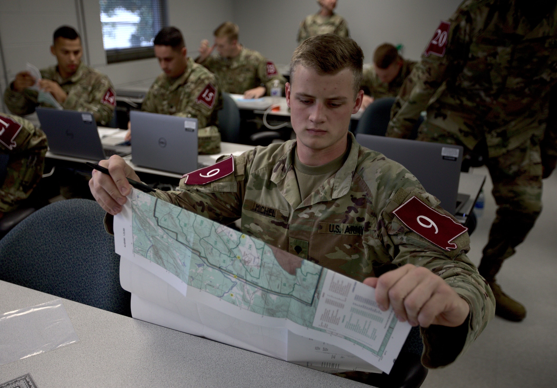 Spc. Dakota Michel participates in a land navigation competition at Fort McClellan, Ala. on May 3, 2021 (Army National Guard photo by Staff Sgt. William Frye).