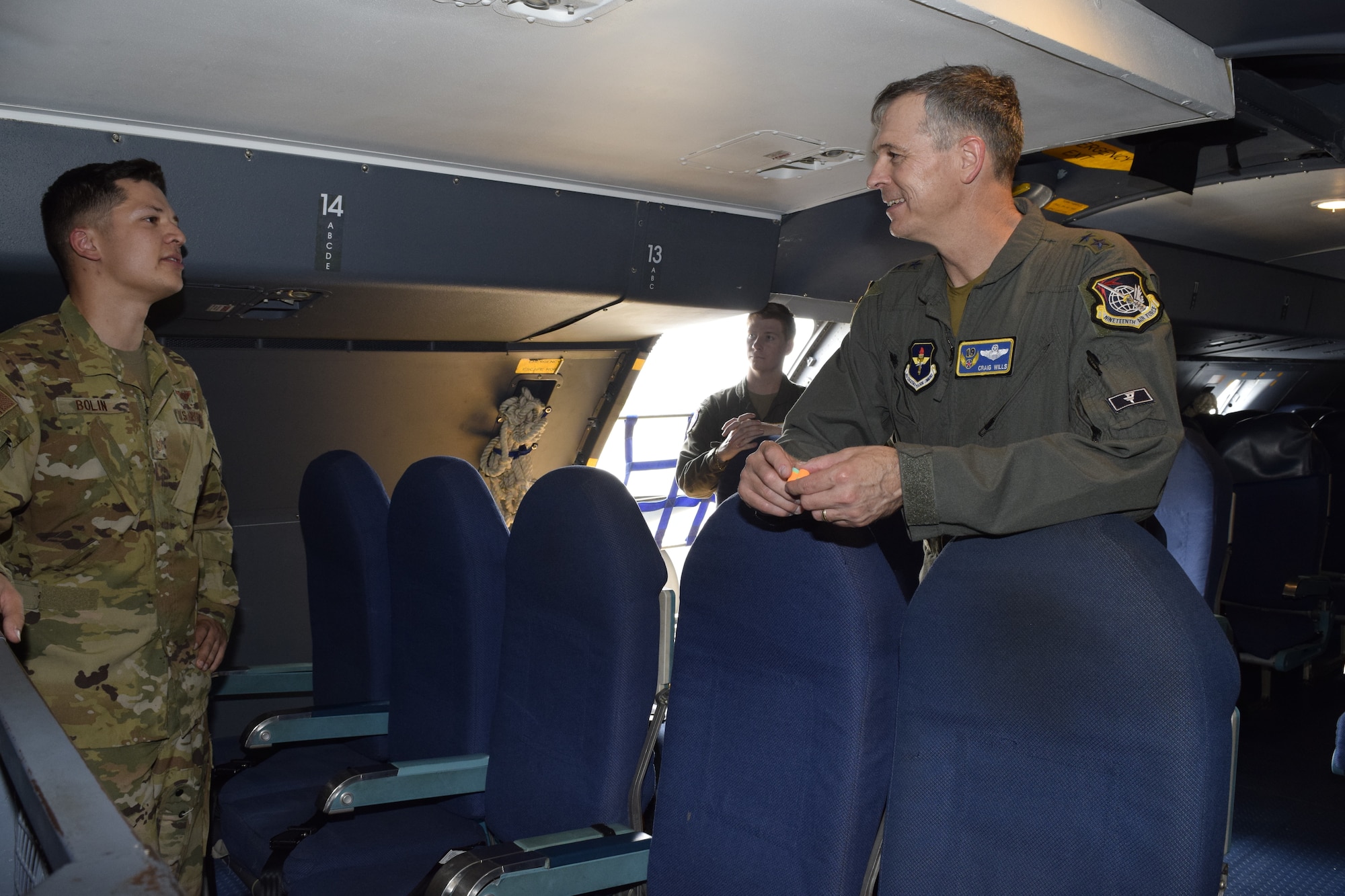 Tech. Sgt. Brent Bolin, 68th Airlift Squadron loadmaster, talks with Maj. Gen. Craig Wills, 19th Air Force commander, on a C-5M Super Galaxy aircraft at Joint Base-San Antonio-Lackland, Texas, May 21, 2021. Wills met with aircrew members to learn more about the C-5M mission. (U.S. Air Force photo by Senior Airman Brittany Wich)