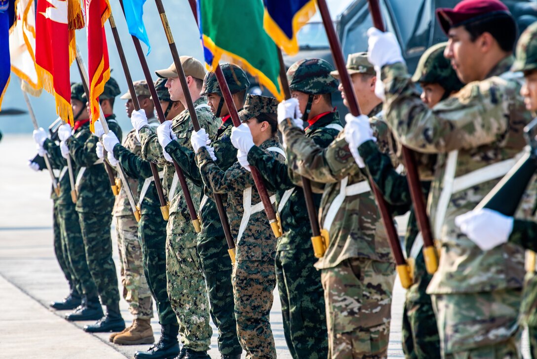 U.S. and Royal Thai Armed forces hold the flags of the participating nations of exercise Cobra Gold 2020 at the Camp Akathotsarot in Phitsanulok province, Kingdom of Thailand, Tuesday Feb. 25, 2020. Exercise Cobra Gold 20, in its 39th iteration, is designed to advance regional security and ensure effective responses to regional crises by bringing together multinational forces to address shared goals and security commitments in the Indo-Asia-Pacific region. (U.S. Navy photo by Mass Communication Specialist 1st Class Julio Rivera)