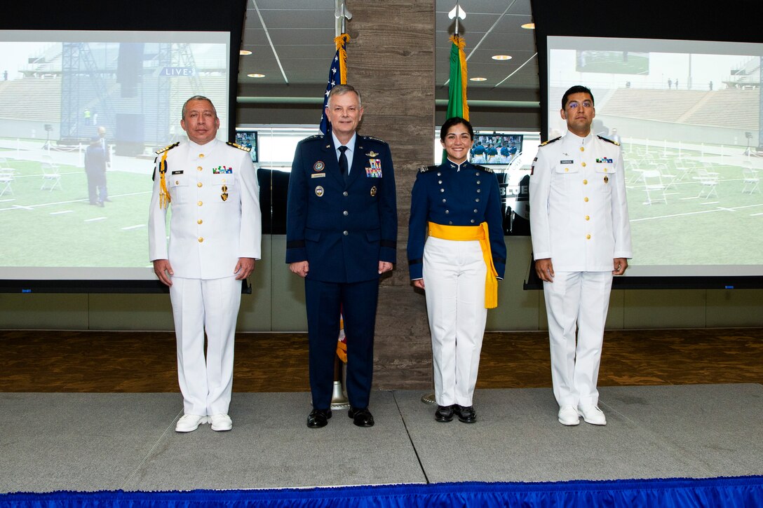 U.S. Air Force Gen. Glen D. VanHerck, commander of North American Aerospace Defense Command and U.S. Northern Command, celebrates with Mexican Navy Cadet Itzel Sinai Chan Topete on her graduation from the U.S. Air Force Academy.