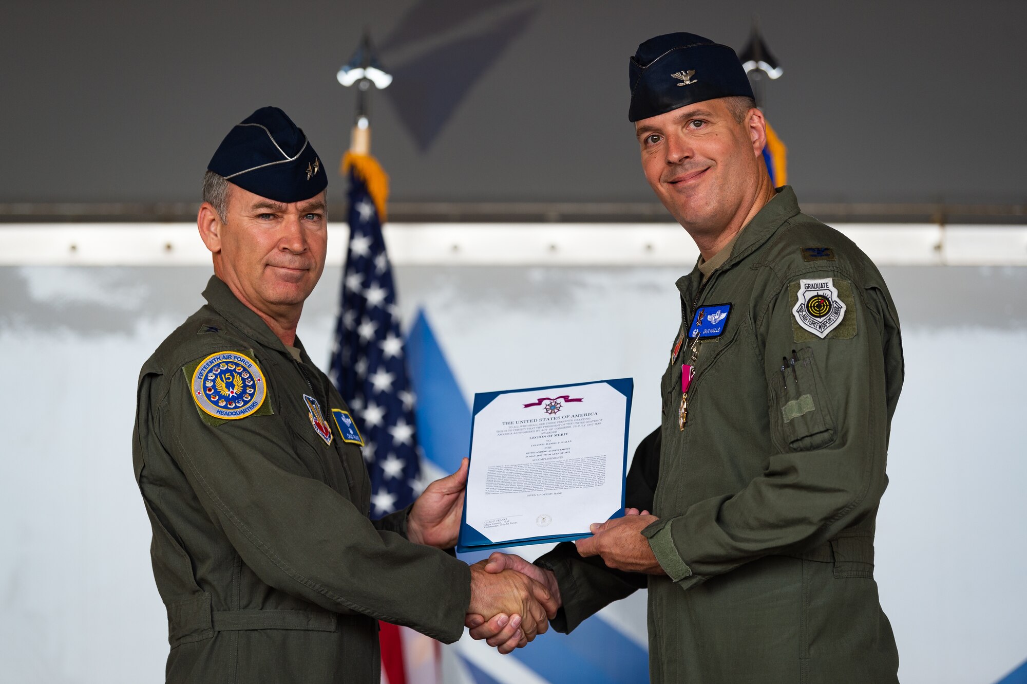 A photo of the 15th Air Force commander presenting the 23d Wing commander with the Legion of Merit