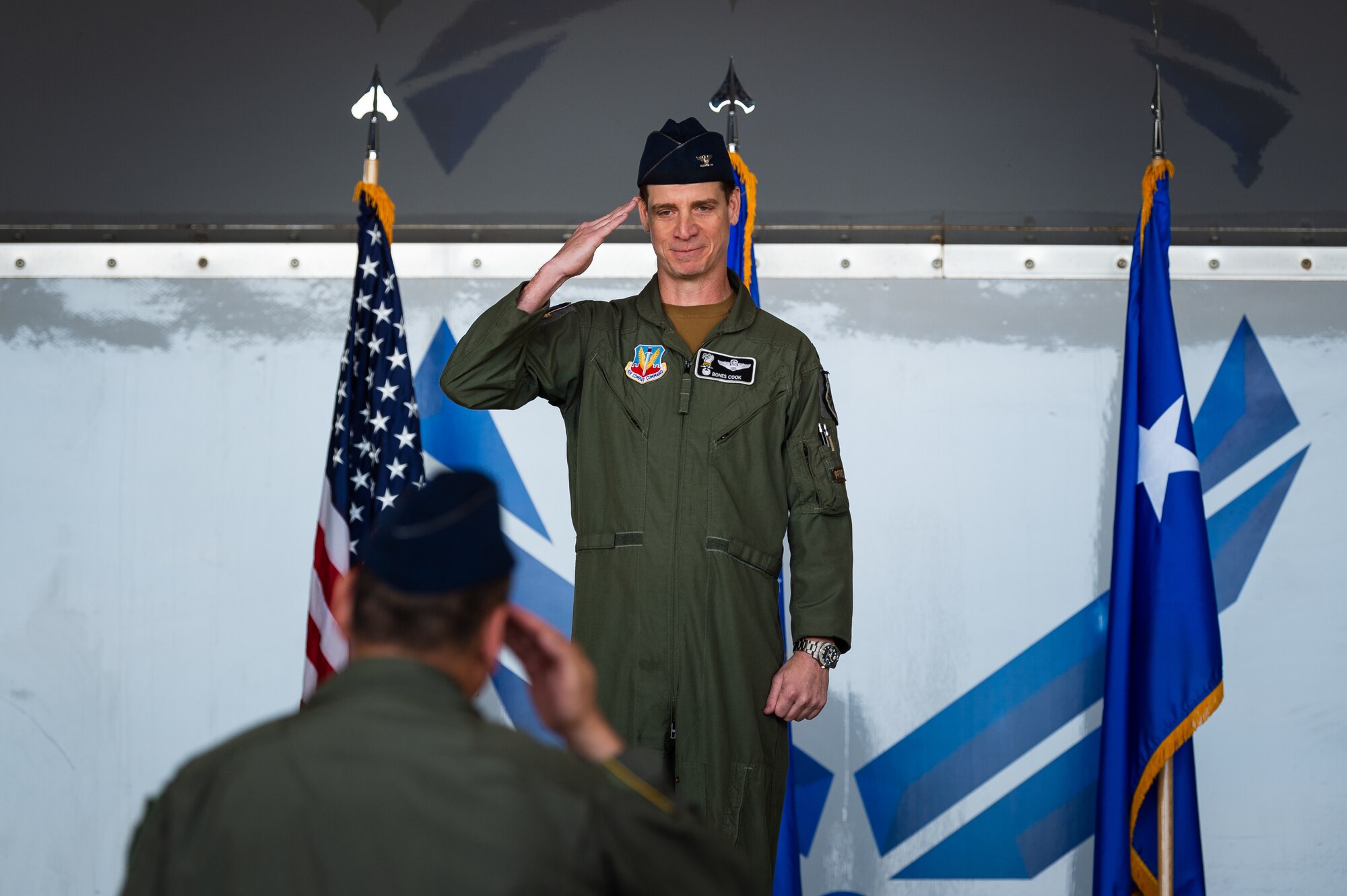 A photo of a commander receiving a salute from a vice commander