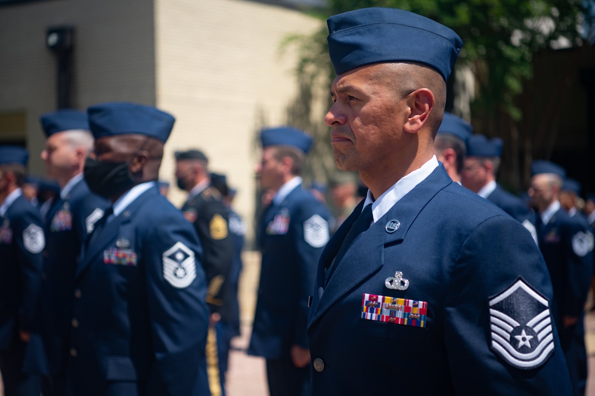 Graduates with Class 21-E stand at attention during a retreat ceremony after their graduation from the Senior Noncommissioned Officer Academy on Maxwell-Gunter Annex, Alabama, May 26, 2020. Class 21-E has logged nearly 882 volunteer hours, they’ve raised over $4,200 for the USO, Pat Tillman Foundation, Enlisted Heritage Hall, Gunter Annex, Lagoon Park trail, Montgomery Food Bank and Support Soldier Suicide and another $1,600 for the Red Tails scholarship and the Chief Master Sergeant of the Air Force scholarship.