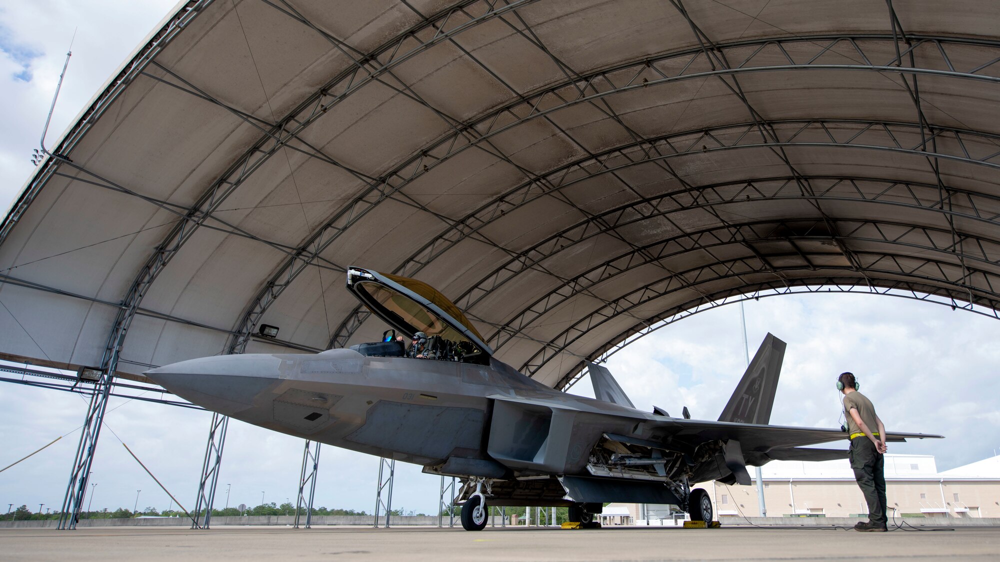 An Airmen prepares an F-22 for flight