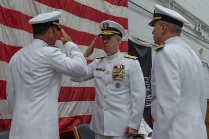 Rear Adm. John F. Meier, Commander, Naval Air Force Atlantic, salutes Capt. Brian C. Becker, outgoing Commander, Strike Fighter Wing Atlantic (CSFWL), during a change of command ceremony