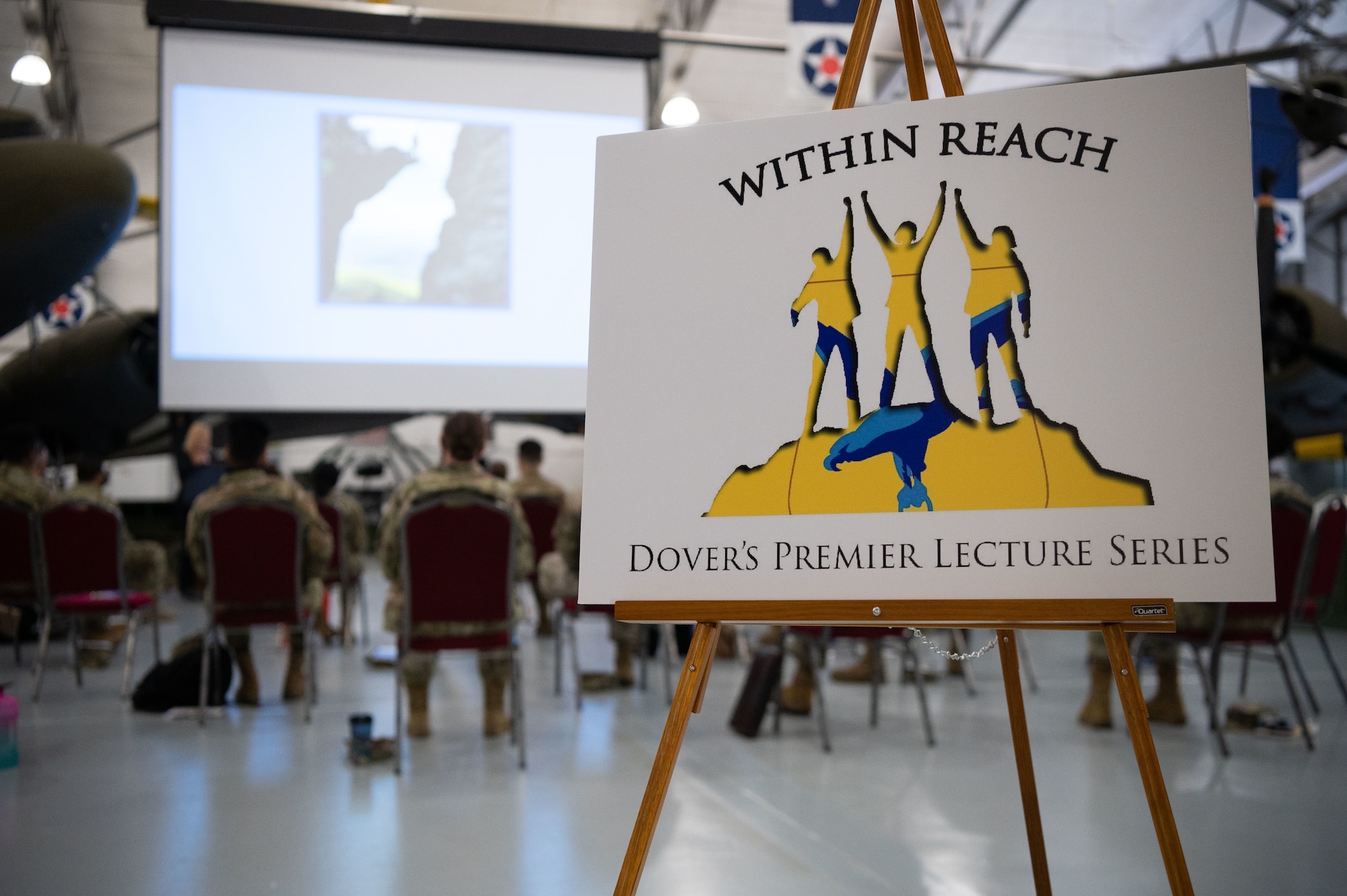 Within Reach lecture series participants gather to hear from Jes DeShields, Ph.D., Crescent Leadership founder and principal consultant, at the Air Mobility Command Museum on Dover Air Force Base, Delaware, May 25, 2021. Seven top-level industry leaders and speakers were invited to speak to Dover AFB Airmen about success and how to achieve realistic goals. (U.S. Air Force photo by Senior Airman Marco A. Gomez)