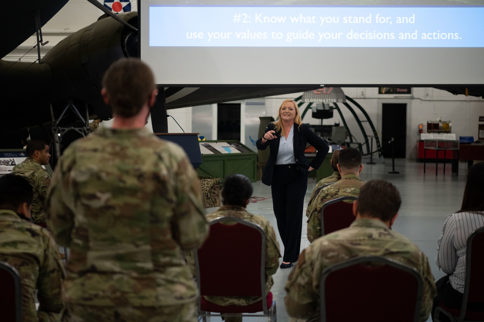 Jes DeShields, Ph.D., Crescent Leadership founder and principal consultant, asks a question to a Within Reach lecture series participant at the Air Mobility Command Museum on Dover Air Force Base, Delaware, May 25, 2021. DeShields spoke to Dover AFB Airmen about success and leadership. (U.S. Air Force photo by Senior Airman Marco A. Gomez)