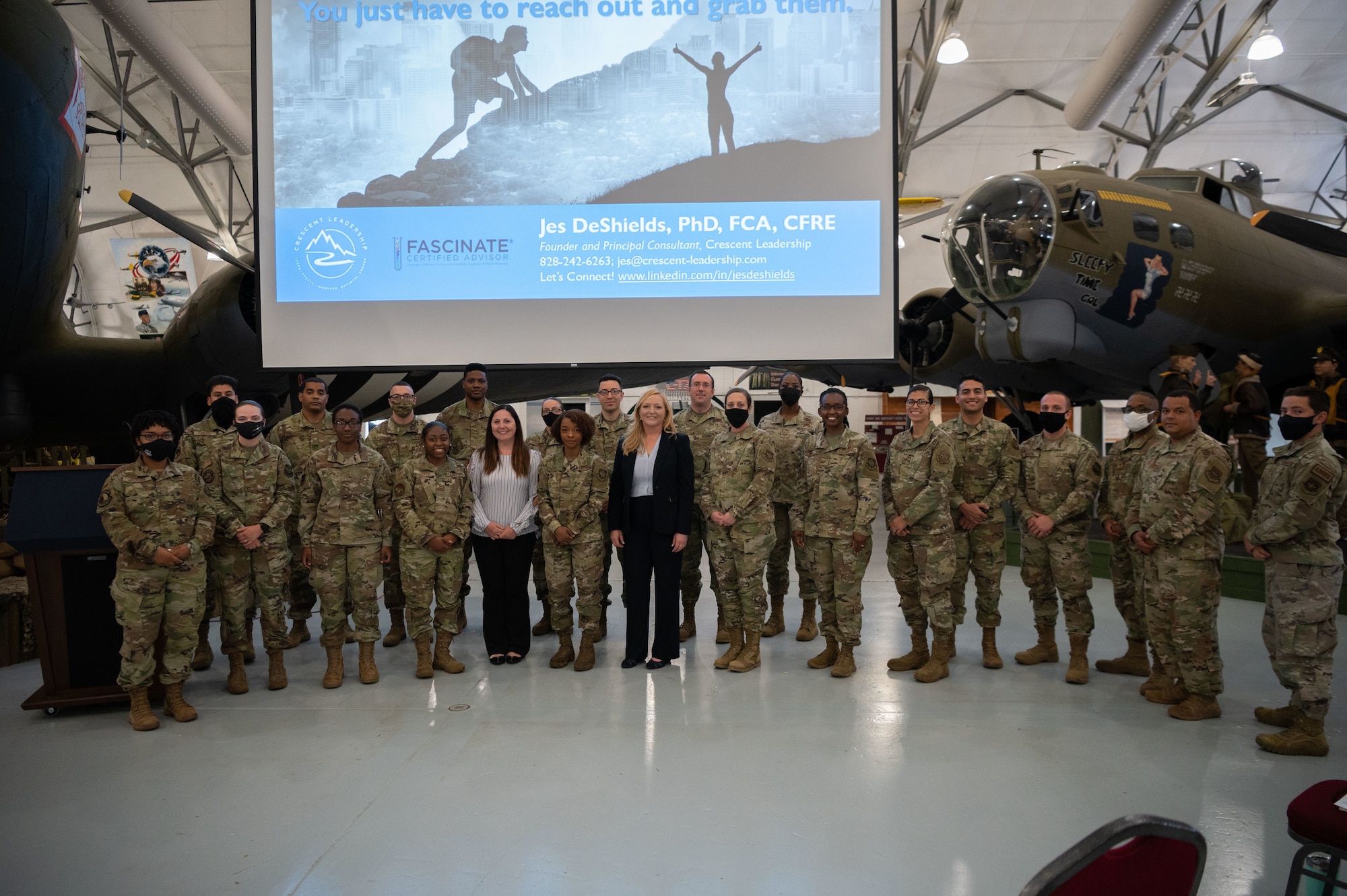 Jes DeShields, Ph.D., Crescent Leadership founder and principal consultant, along with Within Reach lecture series participants, take a group photo at the Air Mobility Command Museum on Dover Air Force Base, Delaware, May 25, 2021. Seven top-level industry leaders and speakers were invited to speak to Dover AFB Airmen about success and how to achieve realistic goals. (U.S. Air Force photo by Senior Airman Marco A. Gomez)