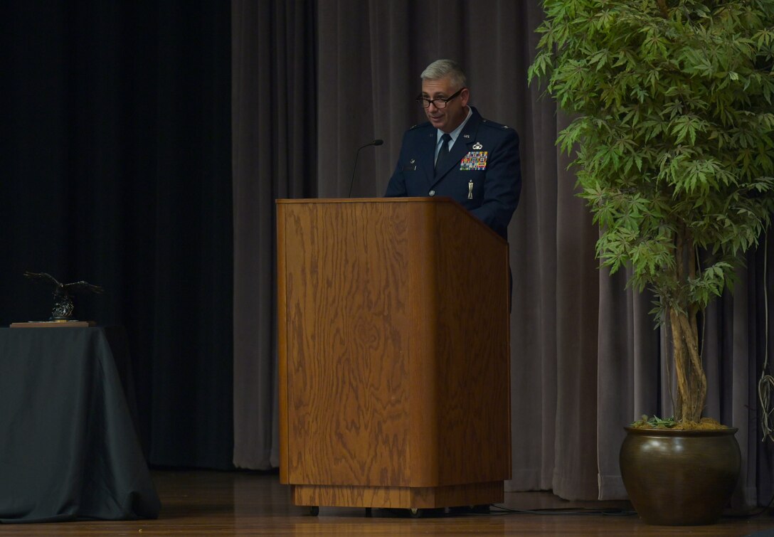 USAF Col. Scott Harron, 193rd Special Operations Mission Support Group commander, speaks to the graduating Specialized Undergraduate Pilot Training class 21-10 May 27, 2021, on Columbus Air Force Base, Miss. Harron manages operations to include civil engineering, disaster preparedness, environmental management, vehicle maintenance, security forces, base services, fuels management, aerial port operations and all other support base functions. (U.S. Air Force photo by Senior Airman Jake Jacobsen)