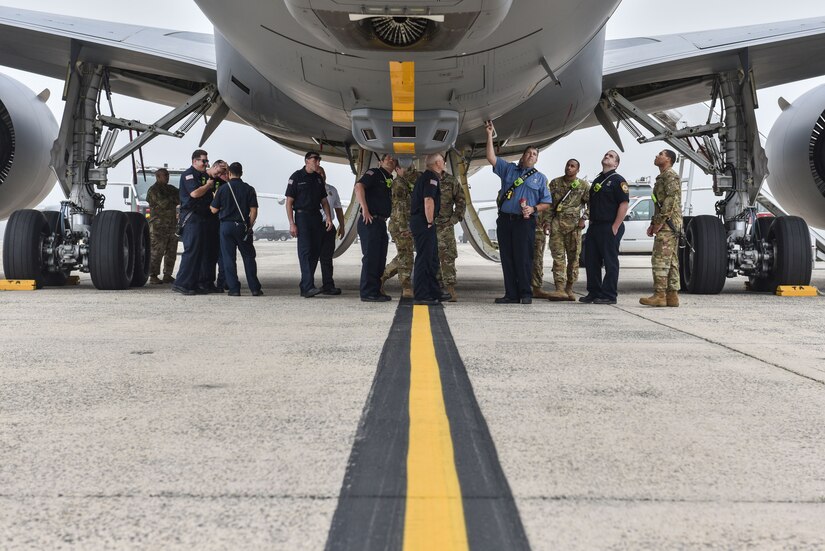 Firefighters from the 87th Civil Engineer Squadron examine the outside of a KC-46 Pegasus while attending a familiarization training for the aircraft at Joint Base McGuire-Dix-Lakehurst, N.J., May 26, 2021. The 87th CES fire department, Security Forces and Aircrew Flight Equipment all visited the KC-46 to become better acquainted with the aircraft. (U.S. Air Force Photo by Senior Airman Shay Stuart)