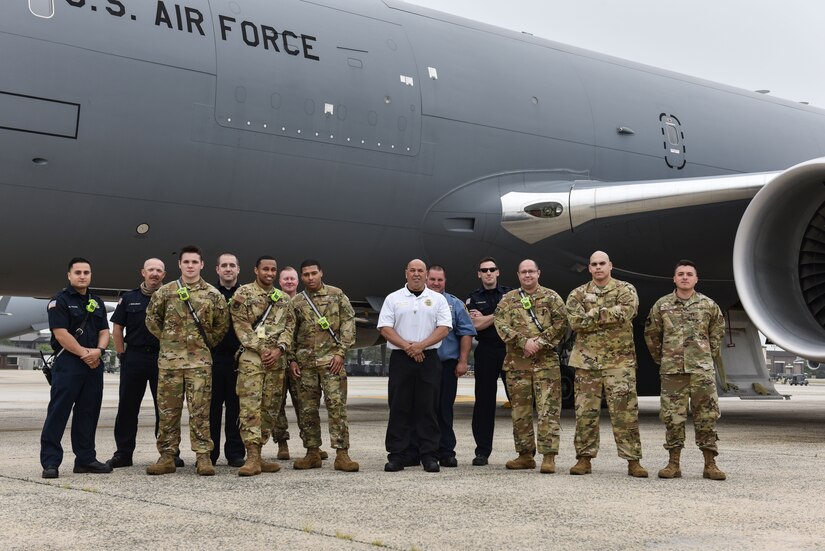 Members from the 87th Civil Engineer Squadron fire department stand alongside a KC-46 Pegasus after completing familiarization training at Joint Base McGuire-Dix-Lakehurst, N.J., May 26, 2021. The training gave 87th CES an opportunity to explore the aircraft in person and locate emergency exits and equipment for safety operations. (U.S. Air Force Photo by Senior Airman Shay Stuart)