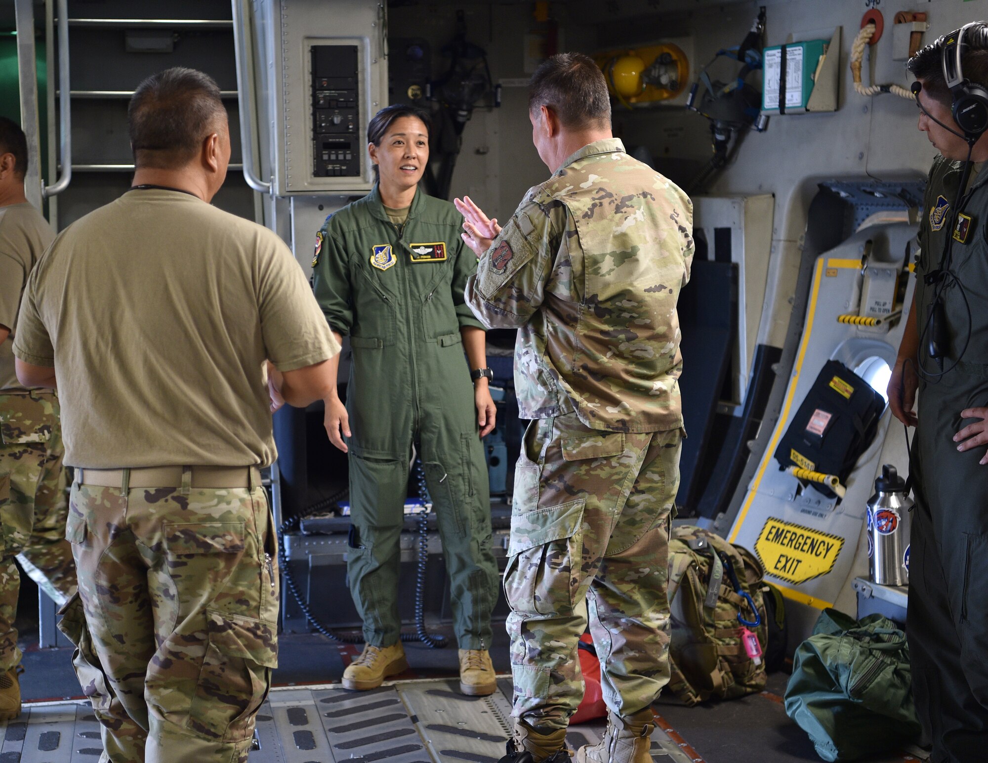 Lt. Col. Blythe Jeanne Itoman, 204th Airlift Squadron C-17 pilot, meets with 154th Maintenance Group maintainers before taking off at Joint Base Pearl Harbor-Hickam, Hawaii, May 25, 2021. In honor of Asian American Pacific Islander Heritage Month, the 15th Wing and 154th Wing flew a routine training mission composed with aircrew and maintainers who were all of Asian American or Pacific Islander descent and were a mix of active duty and Air National Guard members. (U.S. Air Force photo by 1st Lt. Amber R. Kelly-Herard)